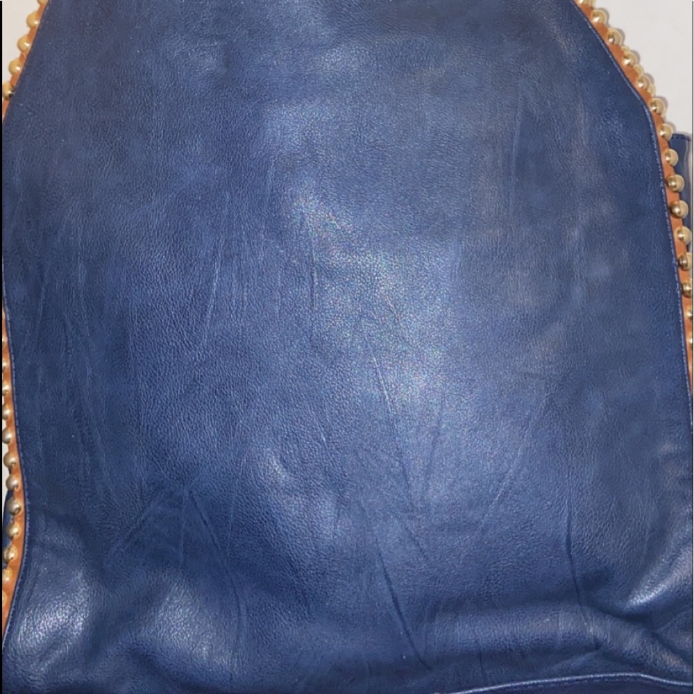 Big Buddha blue handbag with tan trim with gold balls embedded in it